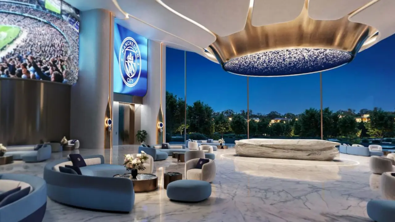 A marble lobby with a sculpted ceiling and lounge seating